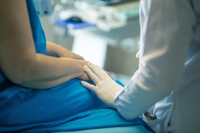 healthcare professional with hand on patient's knee